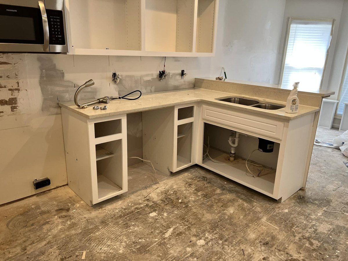 Kitchen before: cabinets damaged by water