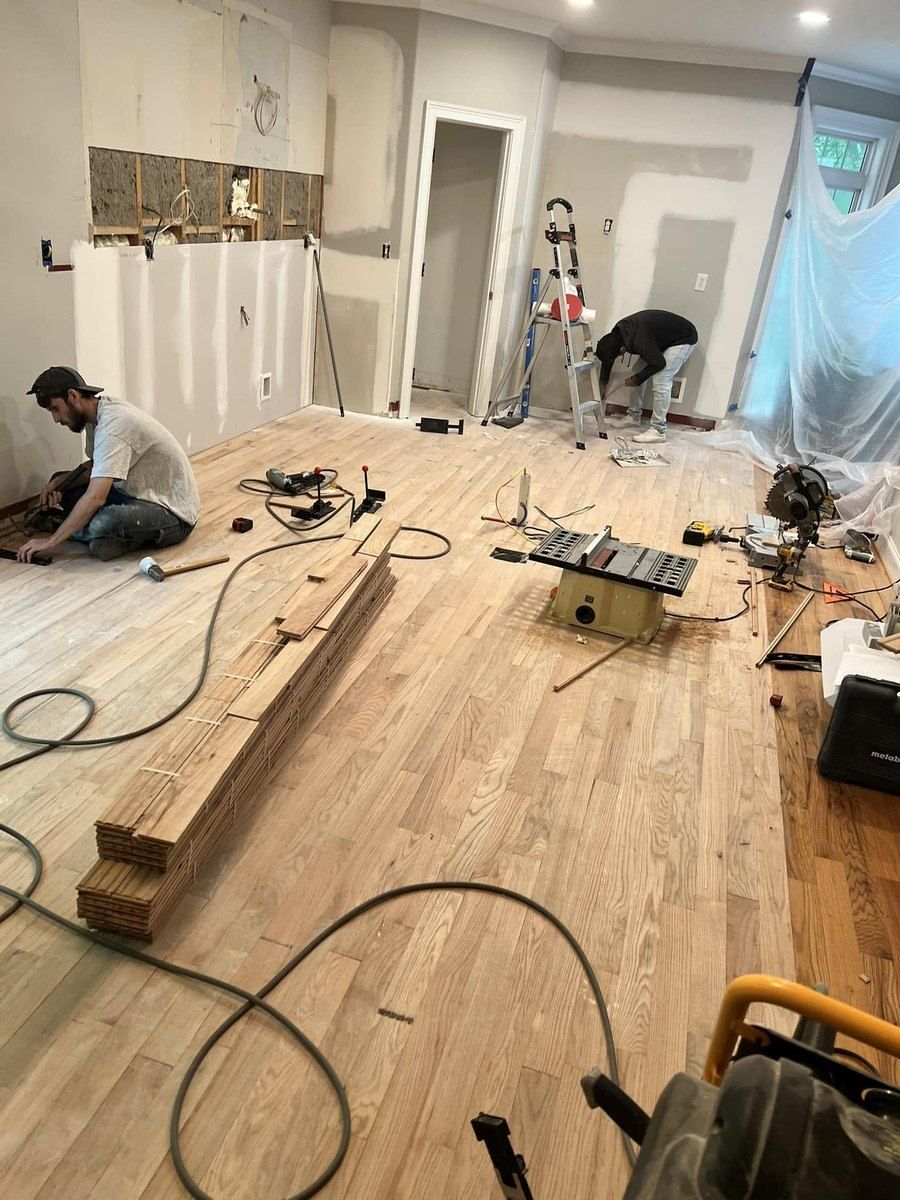 Kitchen during construction with new flooring going in