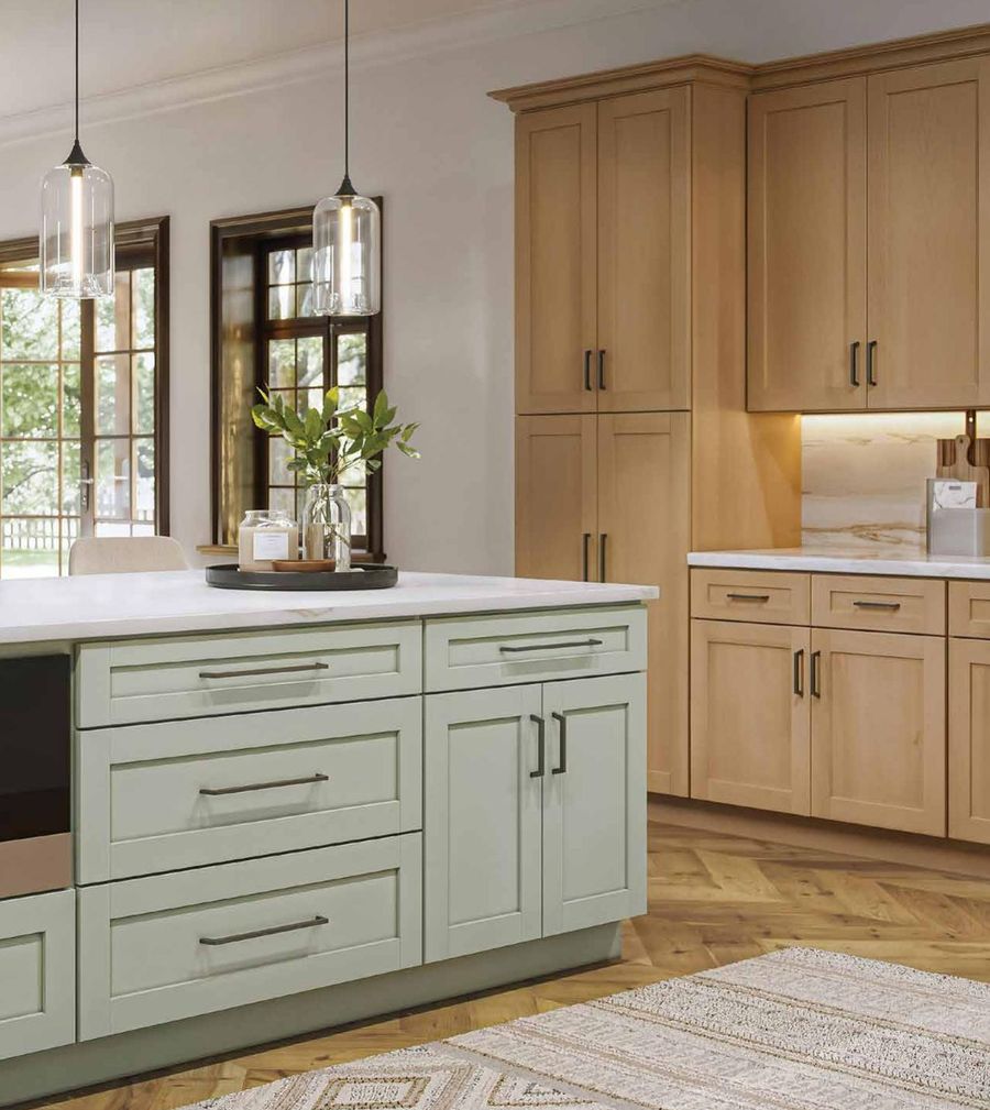 Wood kitchen with a sage green island