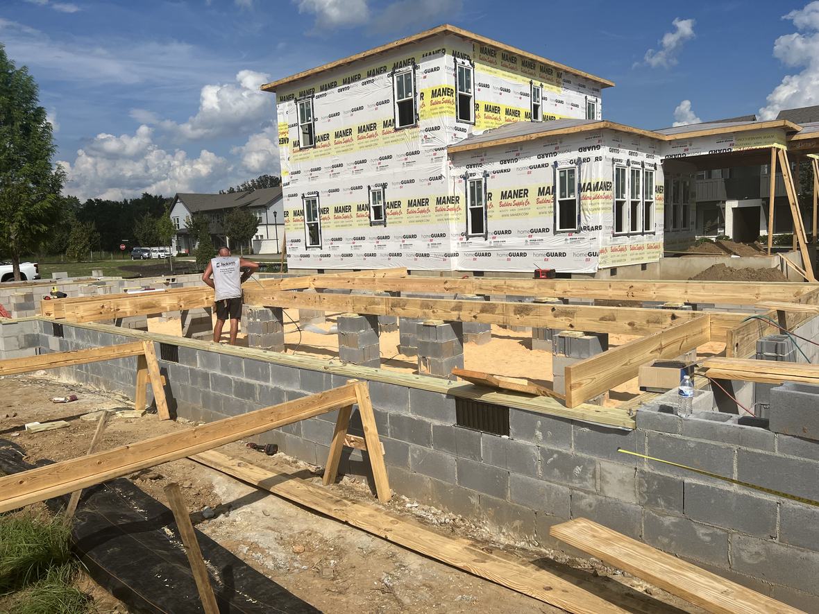 A new home rising over its foundation