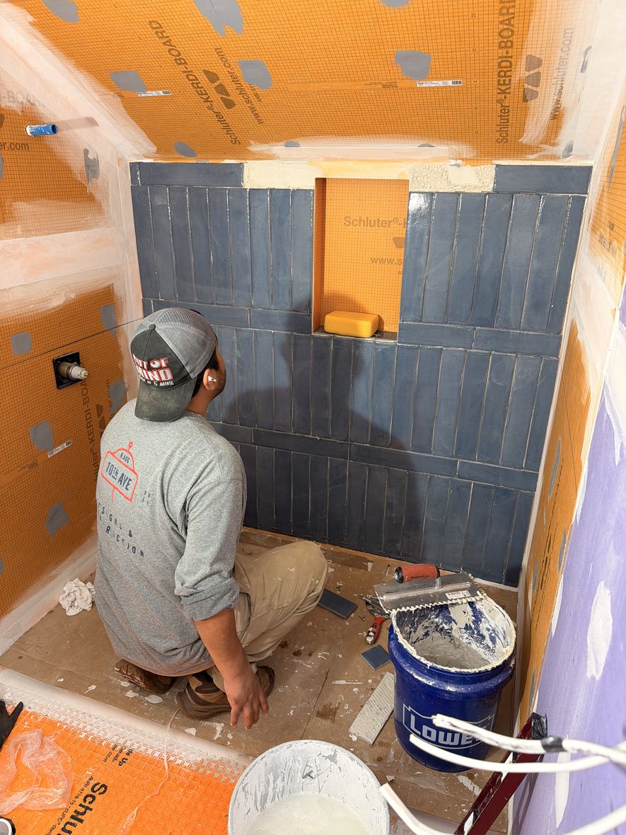 Hand set shower tile over full waterproofing